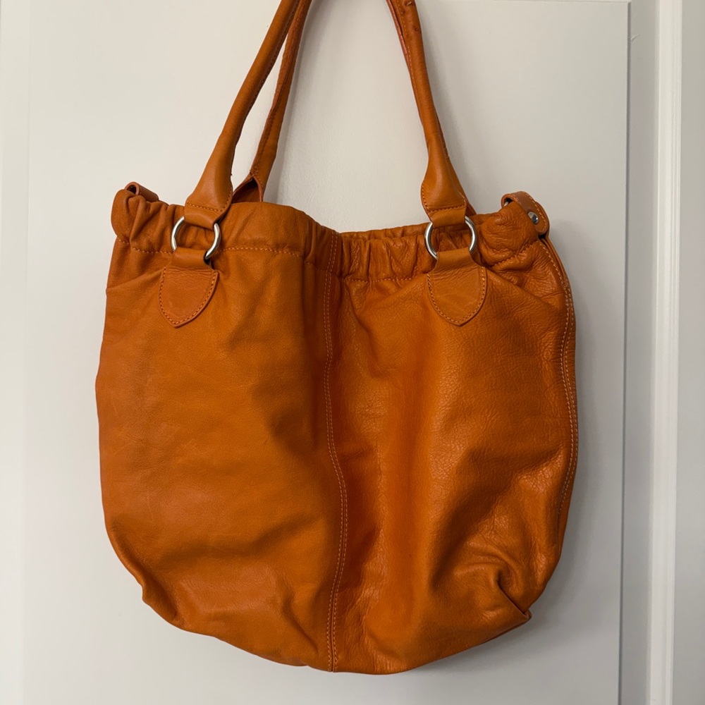 Maurizio Taiuti Genuine Italian Leather Hobo Bag. Color: Orange
